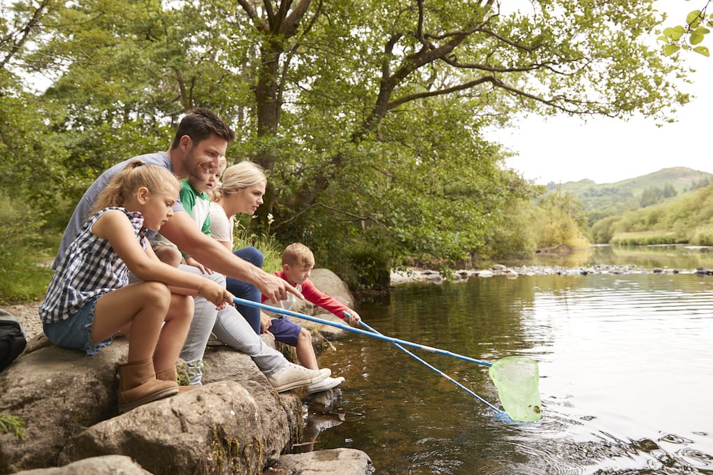 family fishing at lake