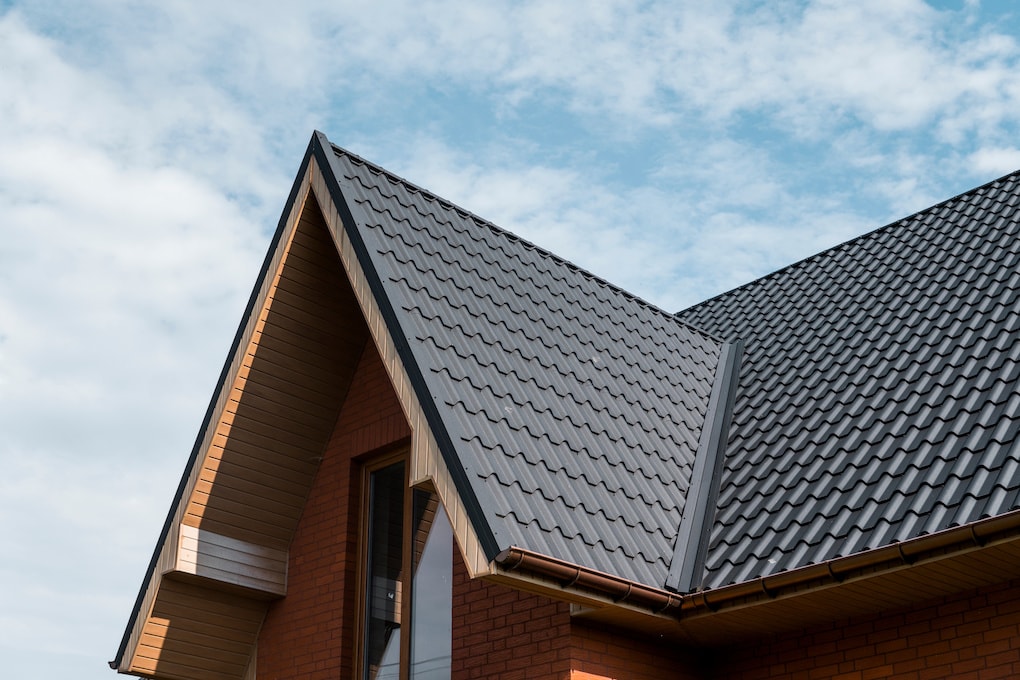 PVC coated roof shingles against blue sky background