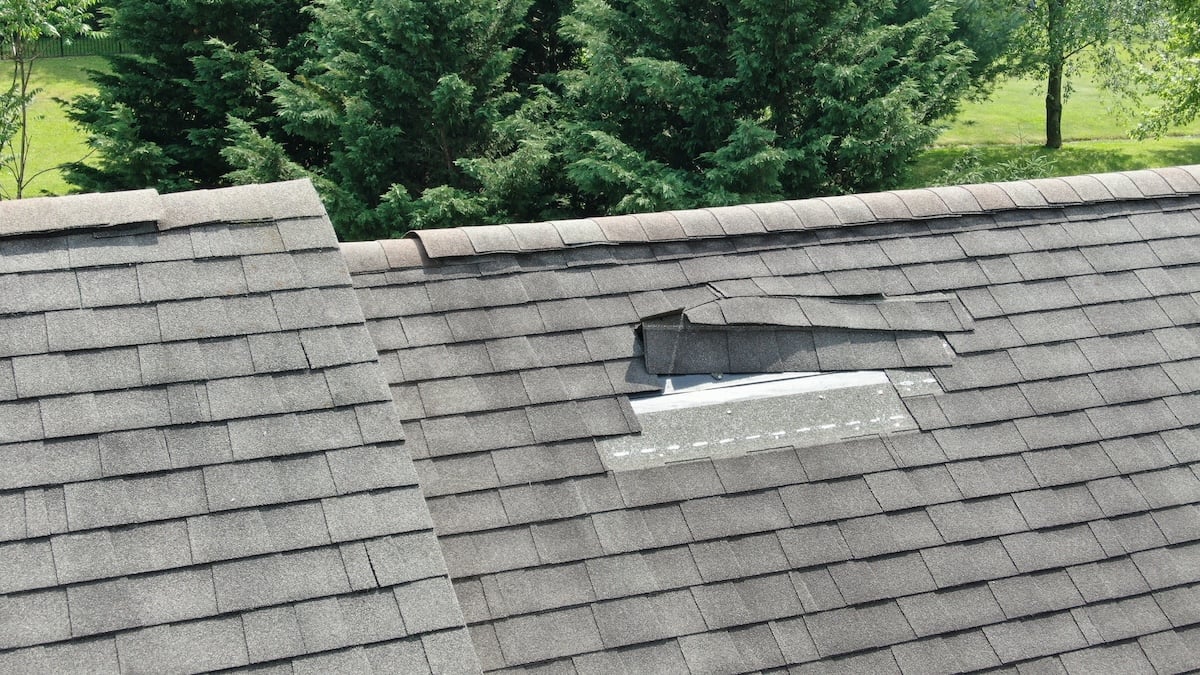a roof with a broken shingle
