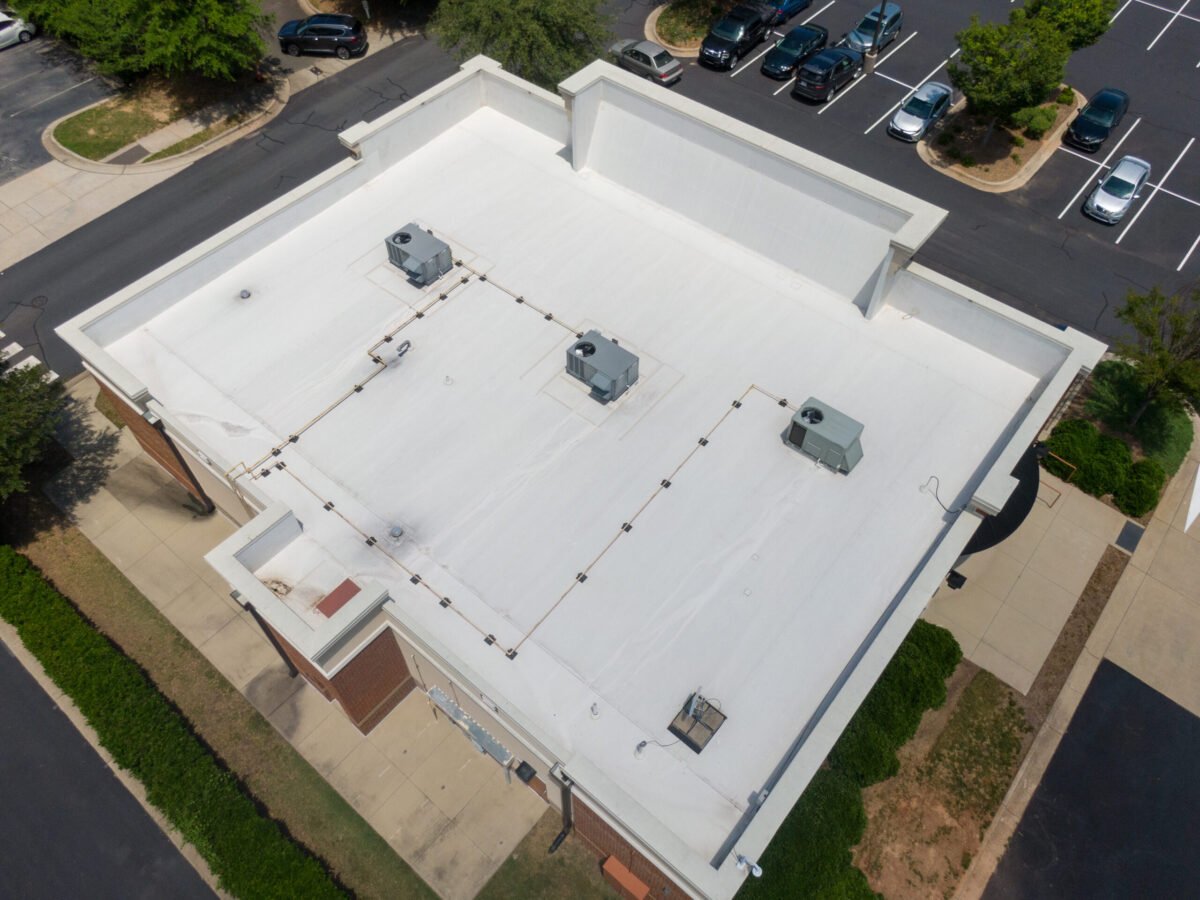 commercial roof inspection Drone Images of Commercial Roofs Featuring TPO and Asphalt Shingles: Midday, Sunny, No People