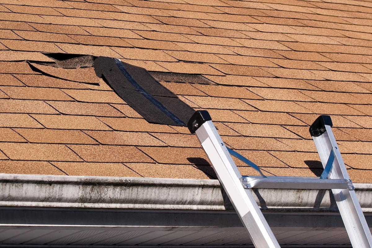 roof leak repair Fixing damaged roof shingles. A section was blown off after a storm with high winds causing a potential leak.