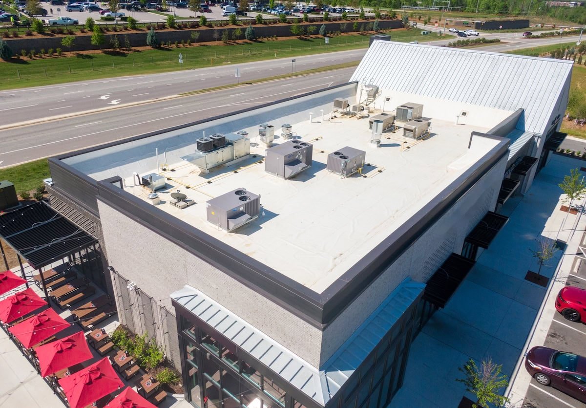 Drone Images of TPO Flat Commercial Roof With Metal Panels: New & Existing Construction