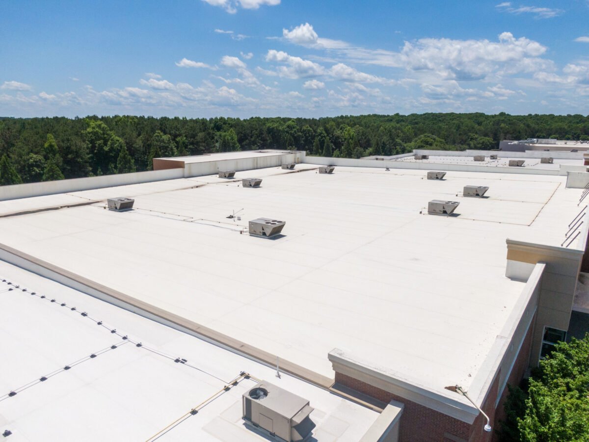 Drone Images of Commercial Roofs Featuring TPO and Asphalt Shingles: Midday, Sunny, No People